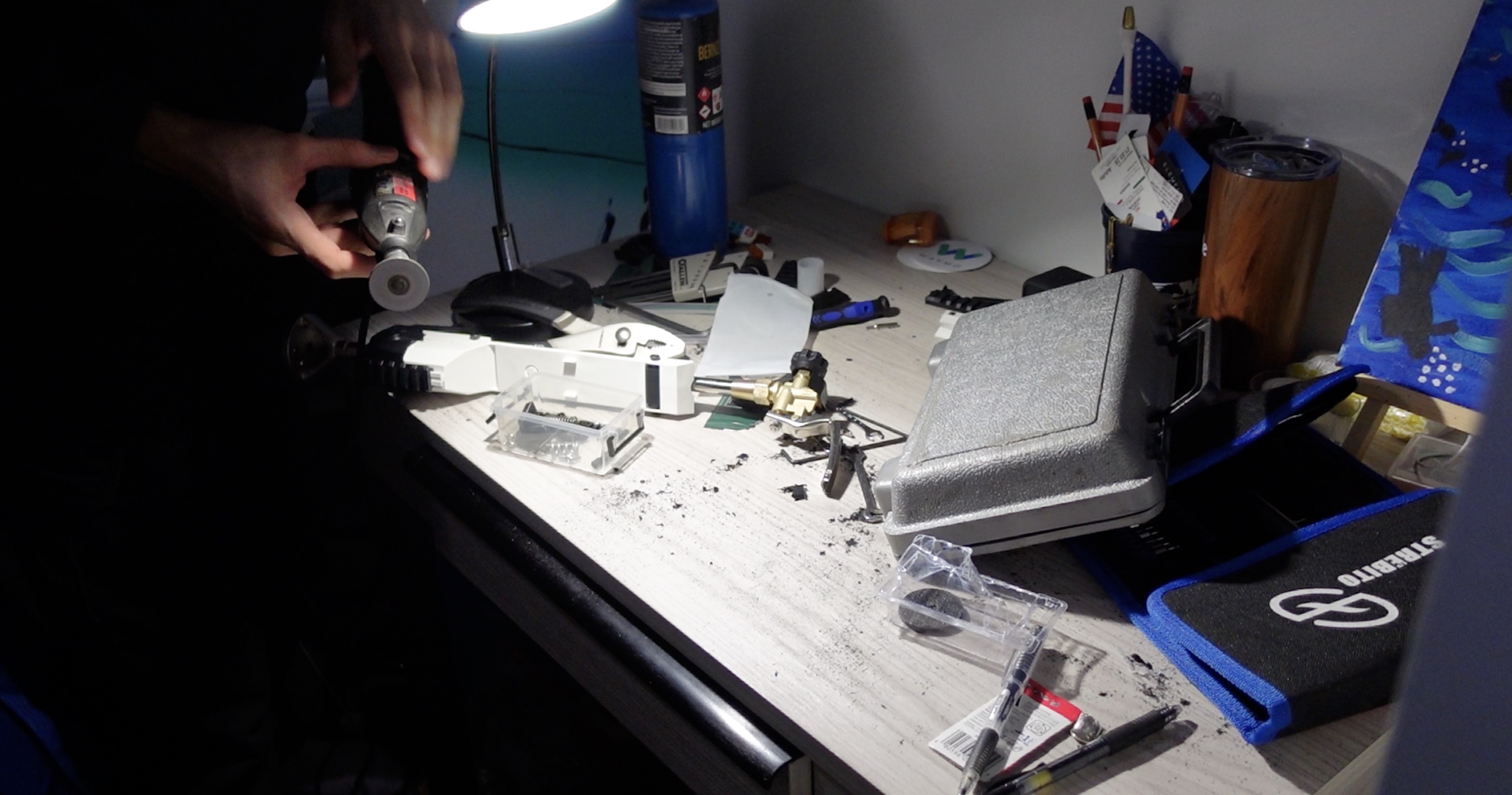 Drill a v shape hole into the propane torch ignition trigger